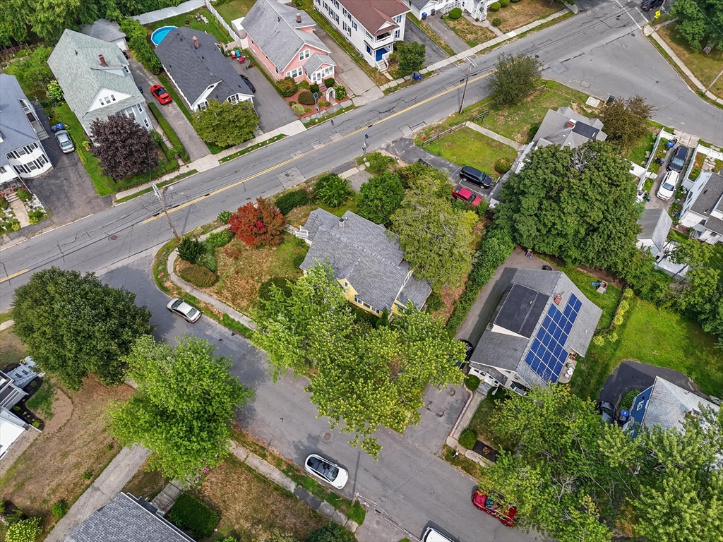 57 Olive Street Methuen, MA 01844 - Photo 35 of 38 an aerial view of a house with a garden and swimming pool