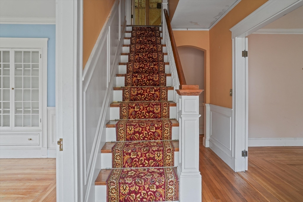 57 Olive Street Methuen, MA 01844 - Photo 10 of 38 a view of a hallway with wooden floor and entryway