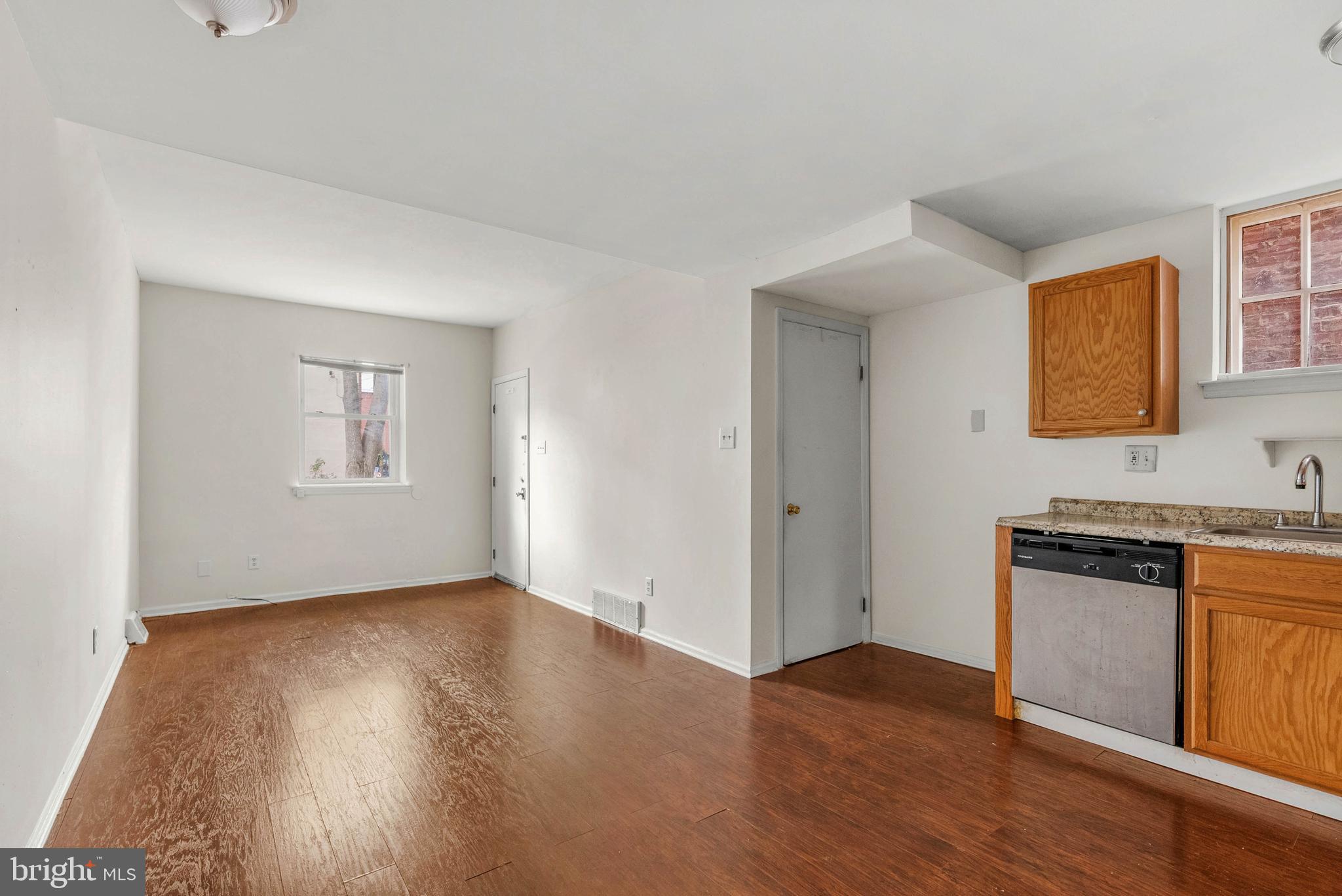 1231 South Philip Street, Unit 1 Philadelphia, PA 19147 - Photo 3 of 8 a view of a kitchen with wooden floor and electronic appliances