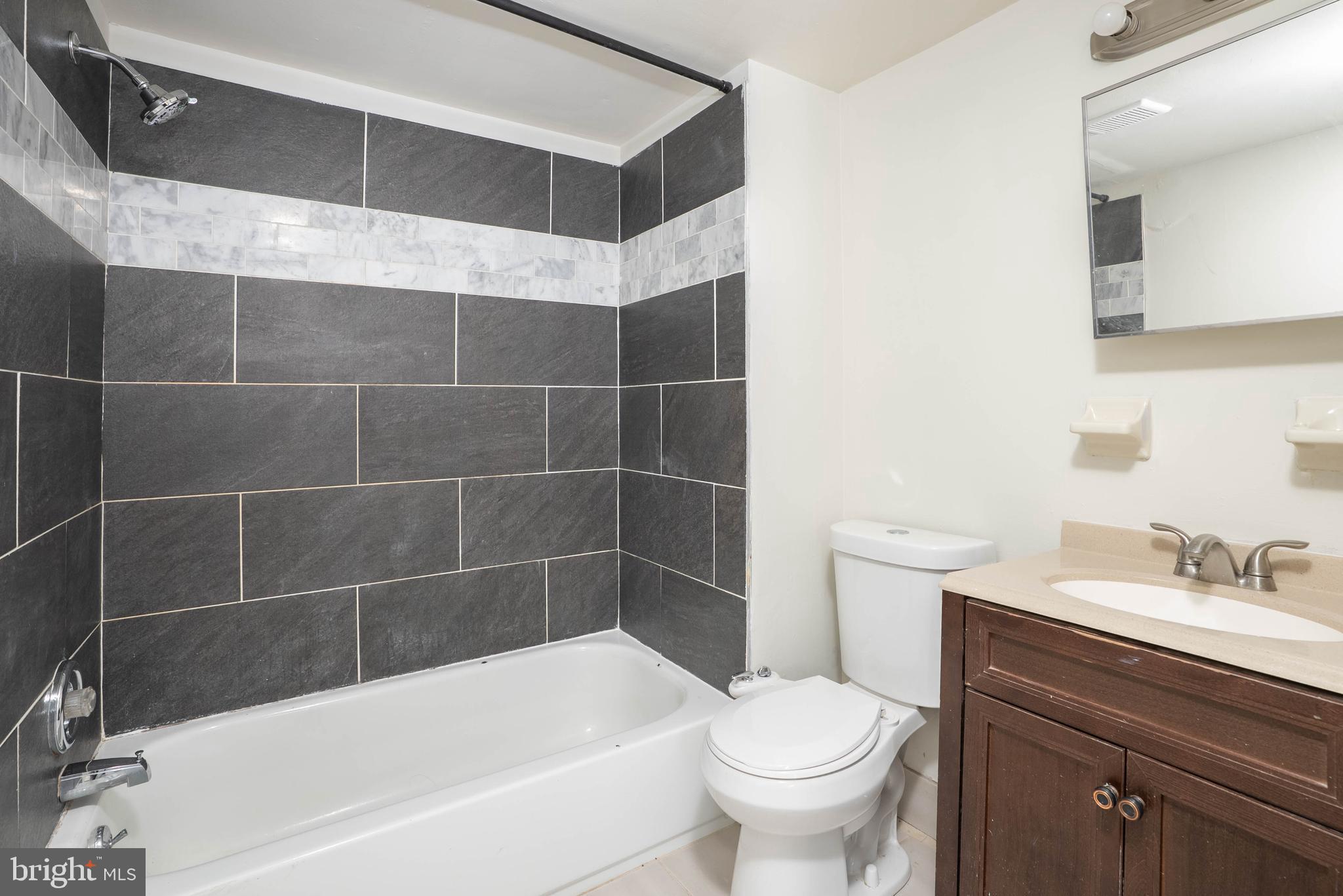 1231 South Philip Street, Unit 1 Philadelphia, PA 19147 - Photo 8 of 8 a bathroom with a sink a toilet and bathtub