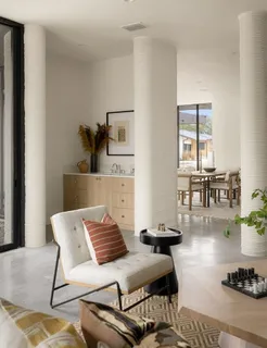 a bathroom with a tub sink double vanity and a mirror