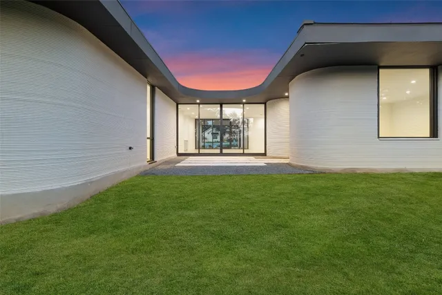 a backyard of a house with lots of green space