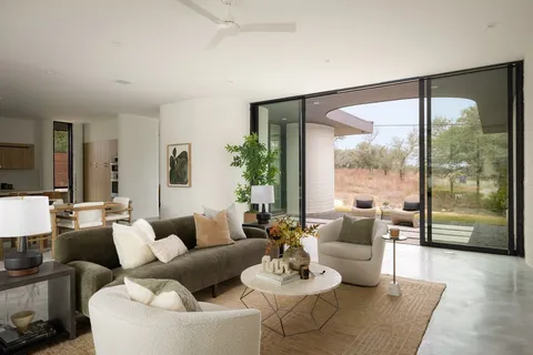 a view of a dining room with furniture and window