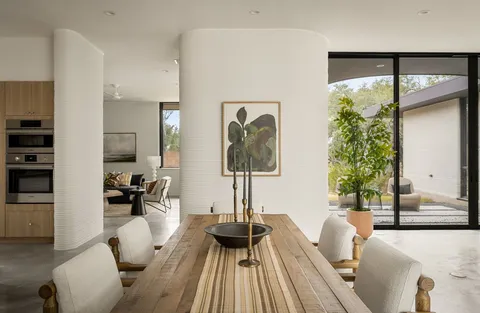 a kitchen that has a sink and a stove in it