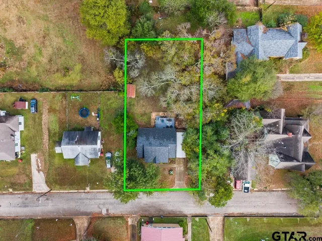 an aerial view of houses with outdoor space