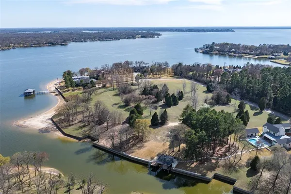 an aerial view of a house with a lake view