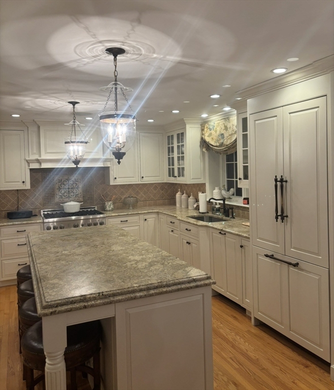 36 Bayberry Lane Hanover, MA 02339 - Photo 9 of 10 a view of a kitchen with a sink and refrigerator