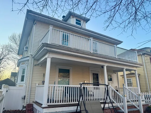 a view of a house with a small yard