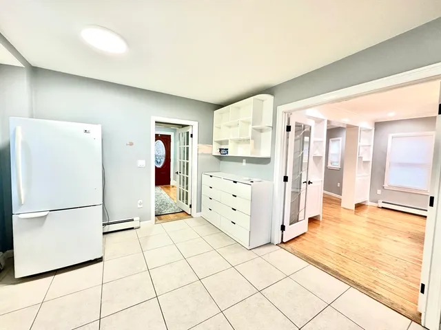 a view of a kitchen with a refrigerator