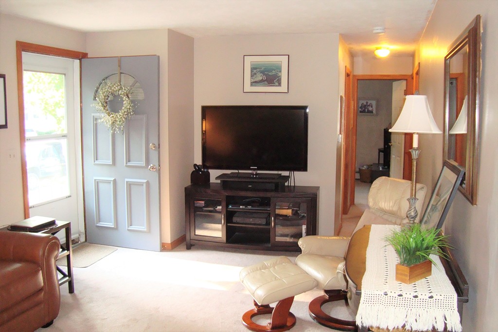 91 Brookside Road Rockland, MA 02370 - Photo 3 of 30 a living room with furniture and a flat screen tv