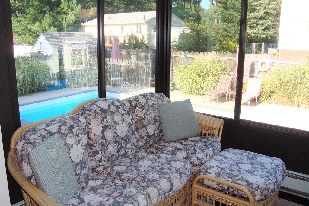 91 Brookside Road Rockland, MA 02370 - Photo 10 of 30 a living room with a bed and a floor to ceiling window