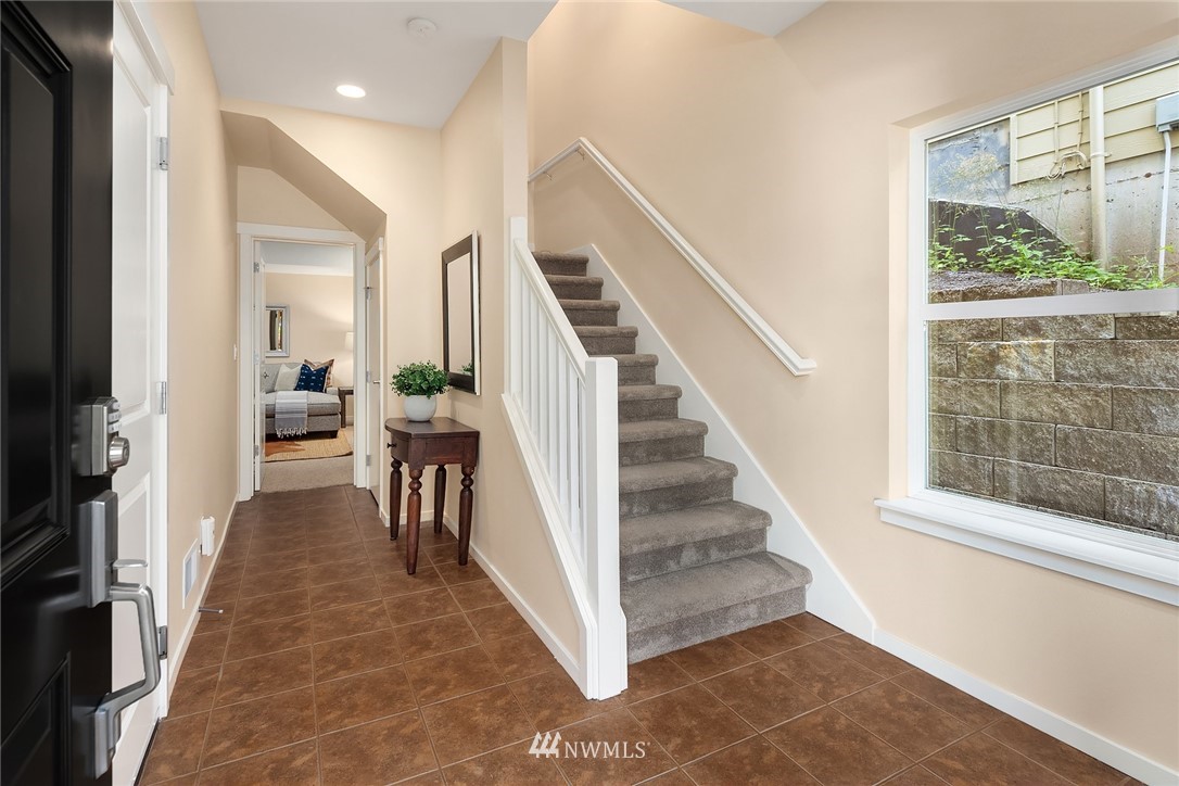 555 Alpine Ridge Place Northwest Issaquah, WA 98027 - Photo 3 of 31 a view of a hallway with windows and stairs