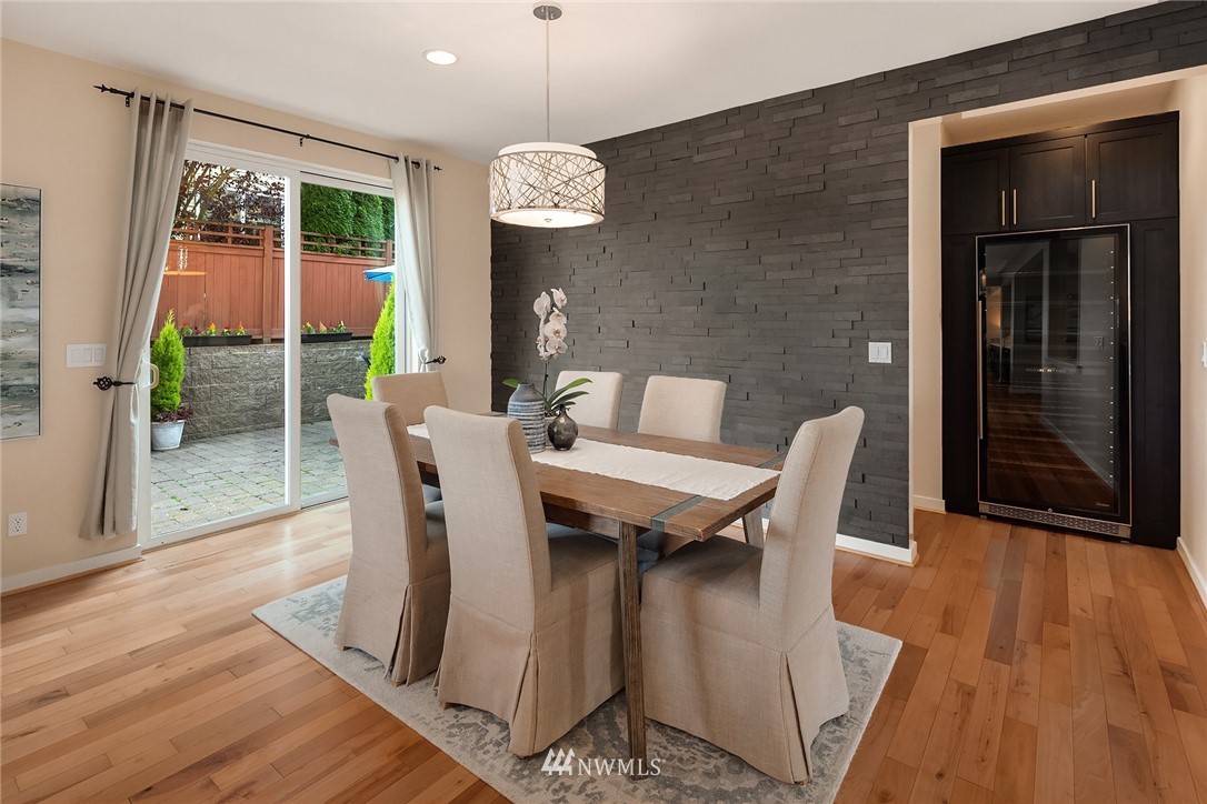 555 Alpine Ridge Place Northwest Issaquah, WA 98027 - Photo 6 of 31 a view of a dining room with furniture window and wooden floor