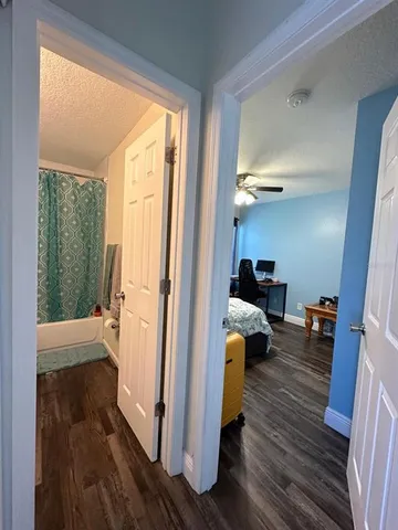 a view of living room and wooden floor