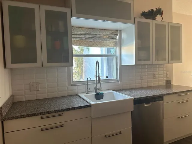 a kitchen with sink and window