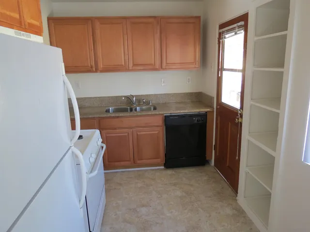 a utility room with a sink a washer and dryer