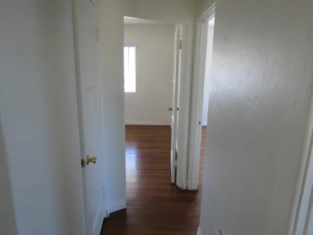 a view of a bathroom with wooden floor