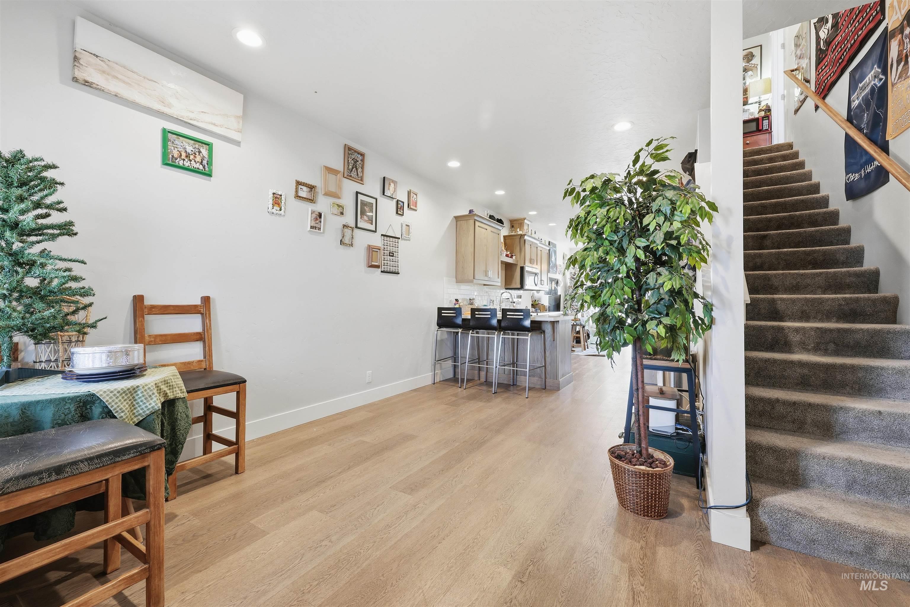 6341 South Ruddsdale Avenue Boise, ID 83709 - Photo 16 of 41 Stairs featuring recessed lighting, wood finished floors, and a wall unit AC