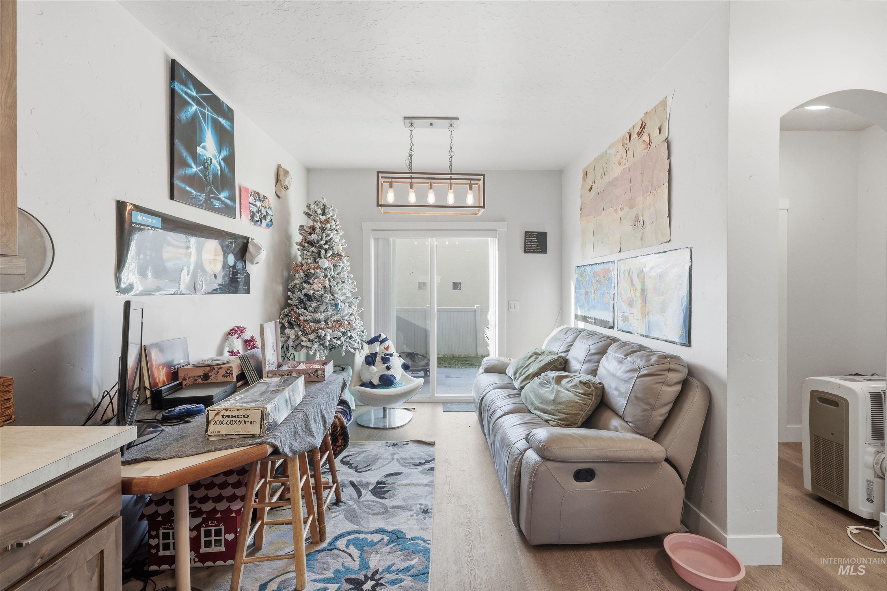 6341 South Ruddsdale Avenue Boise, ID 83709 - Photo 21 of 41 Living area with light wood-type flooring and arched walkways