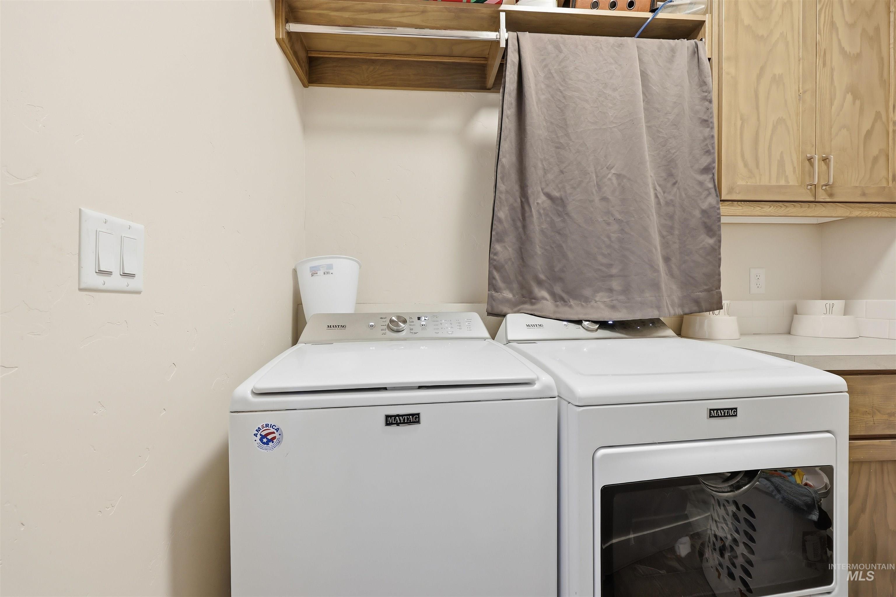 6341 South Ruddsdale Avenue Boise, ID 83709 - Photo 24 of 41 Laundry area featuring cabinet space and washing machine and dryer