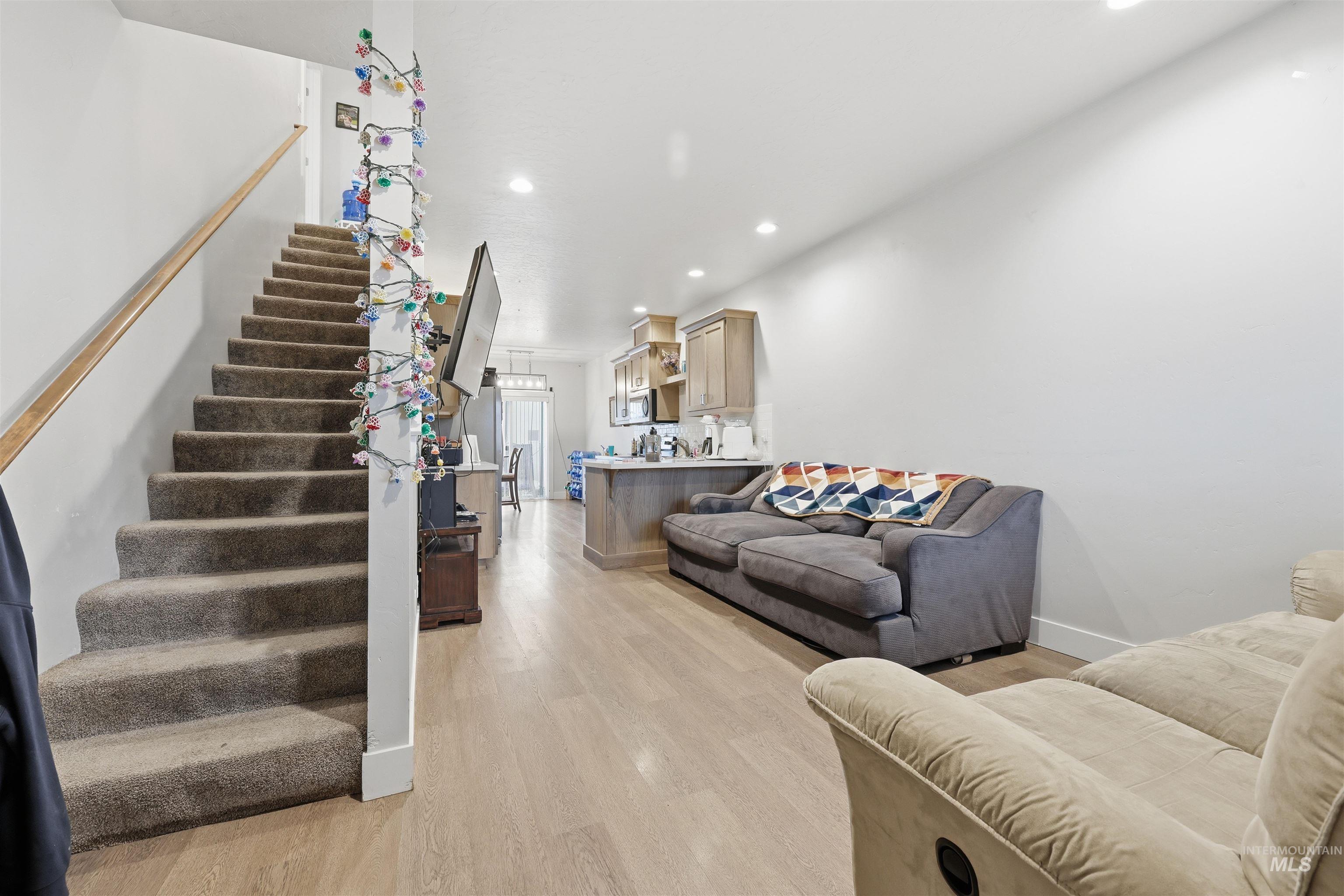 6341 South Ruddsdale Avenue Boise, ID 83709 - Photo 3 of 41 Living room with stairs, light wood-style floors, and recessed lighting