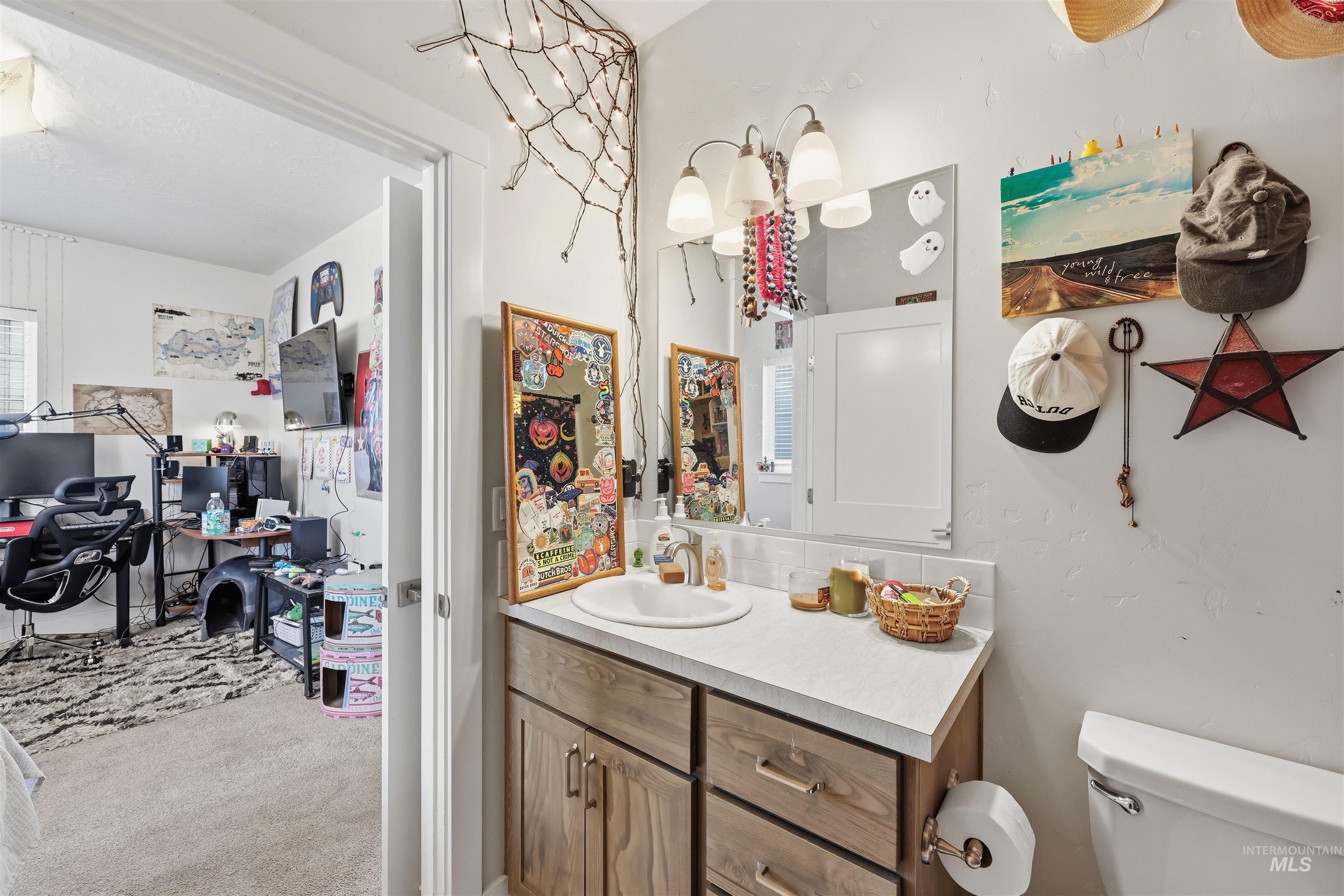 6341 South Ruddsdale Avenue Boise, ID 83709 - Photo 30 of 41 Half bath featuring vanity and light colored carpet