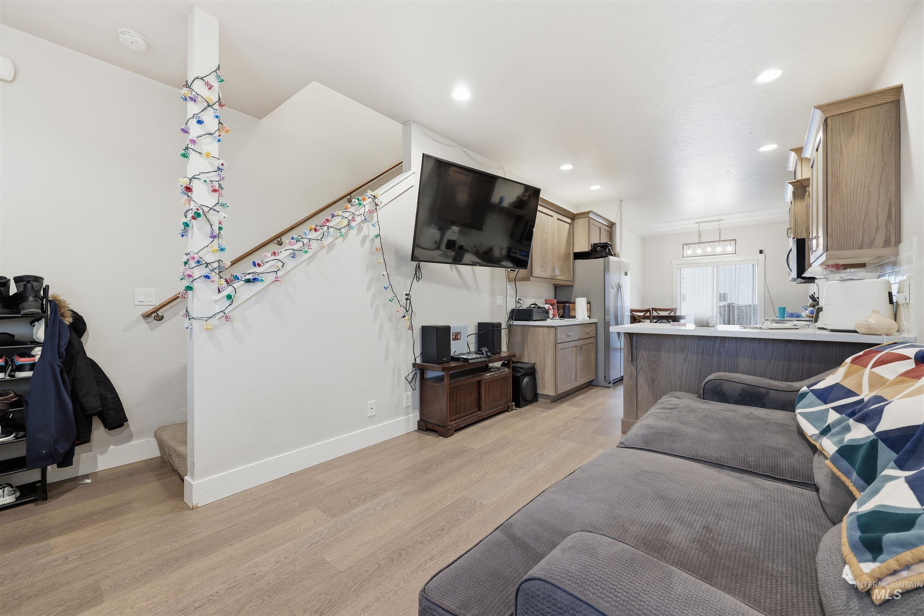 6341 South Ruddsdale Avenue Boise, ID 83709 - Photo 4 of 41 Living area featuring light wood finished floors, stairs, and recessed lighting