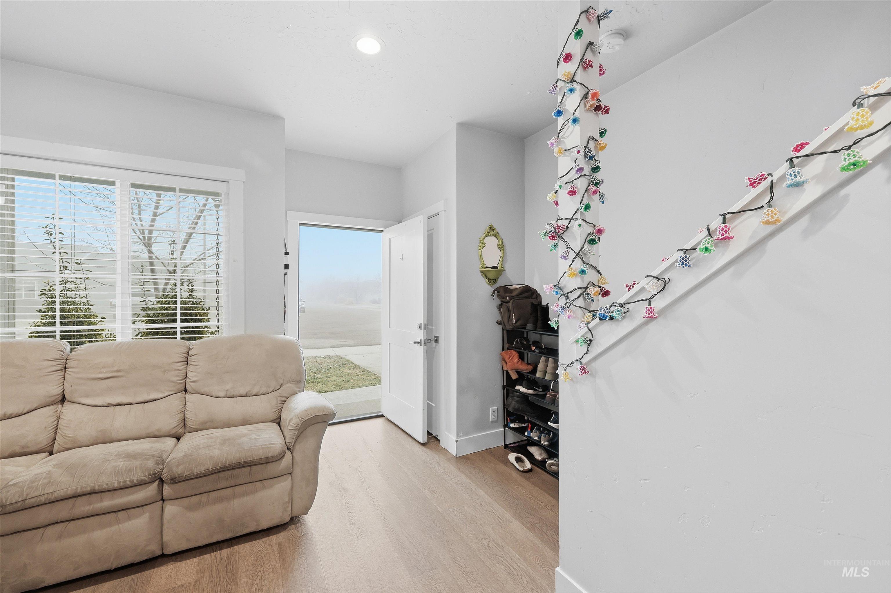 6341 South Ruddsdale Avenue Boise, ID 83709 - Photo 5 of 41 Living room with light wood-type flooring and baseboards