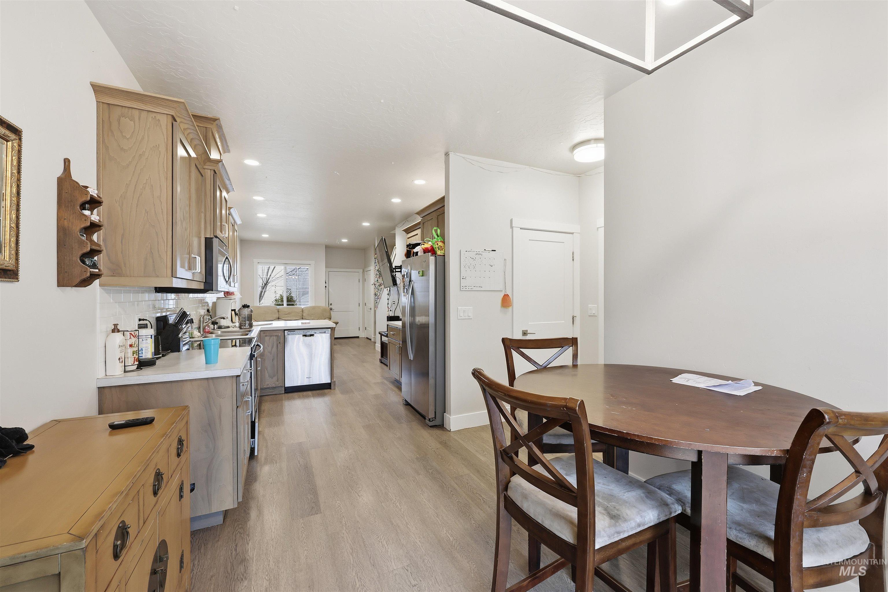 6341 South Ruddsdale Avenue Boise, ID 83709 - Photo 7 of 41 Dining room with light wood finished floors and recessed lighting