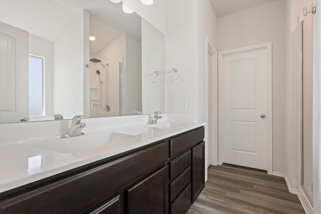 6317 Elephant Butte Drive Waco, TX 76708 - Photo 22 of 39 Dual vanity with integrated sinks and chrome fixtures