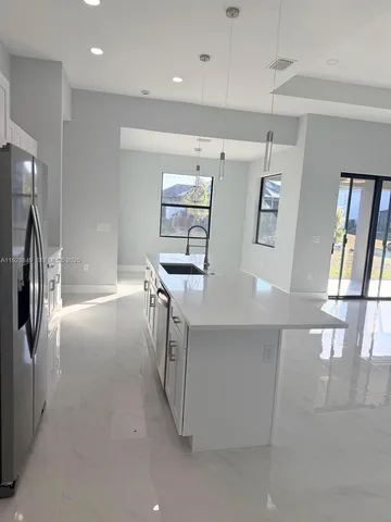 a view of a refrigerator in kitchen