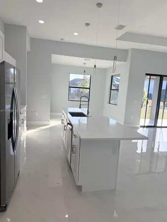 a view of a refrigerator in kitchen