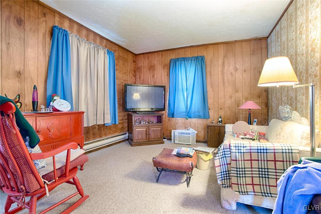 1071 Interchange Road Gilbert, PA 18331 - Photo 6 of 22 a bedroom with furniture and a flat screen tv