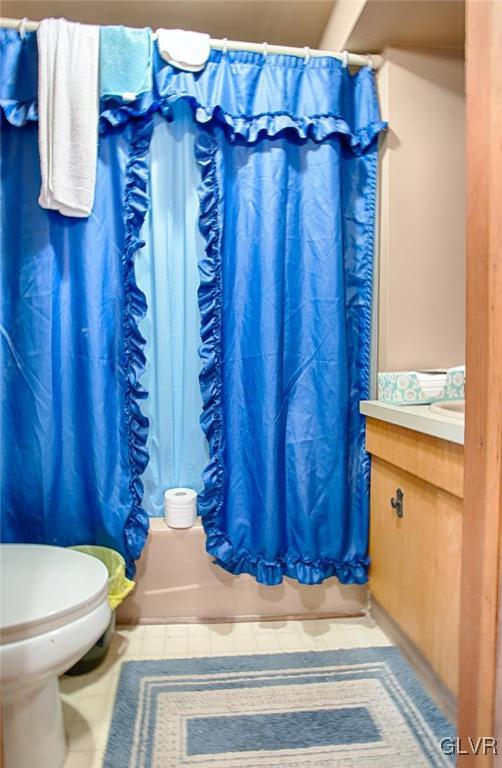1071 Interchange Road Gilbert, PA 18331 - Photo 8 of 22 a bathroom with a toilet and a shower curtain