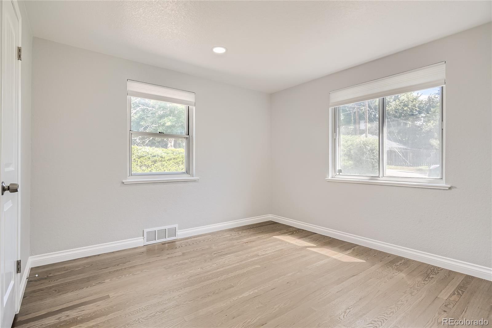 3485 Teller Street Wheat Ridge, CO 80033 - Photo 5 of 9 an empty room with a window