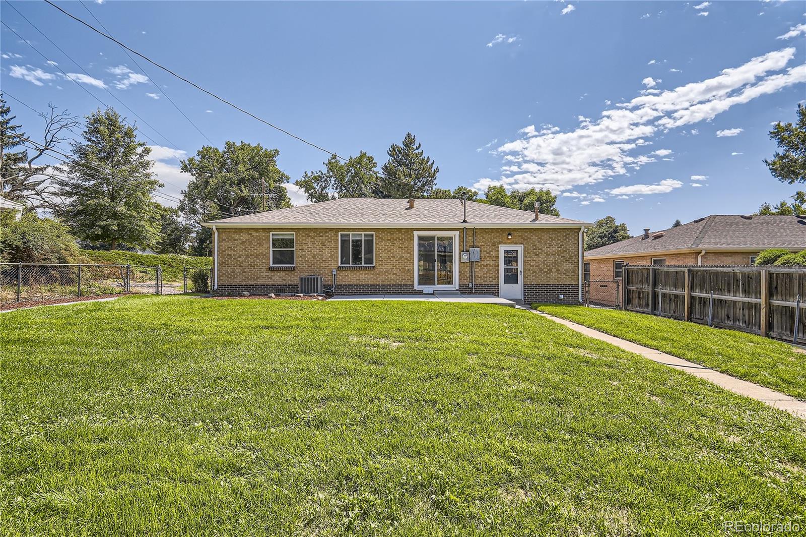 3485 Teller Street Wheat Ridge, CO 80033 - Photo 8 of 9 a view of a house with a backyard