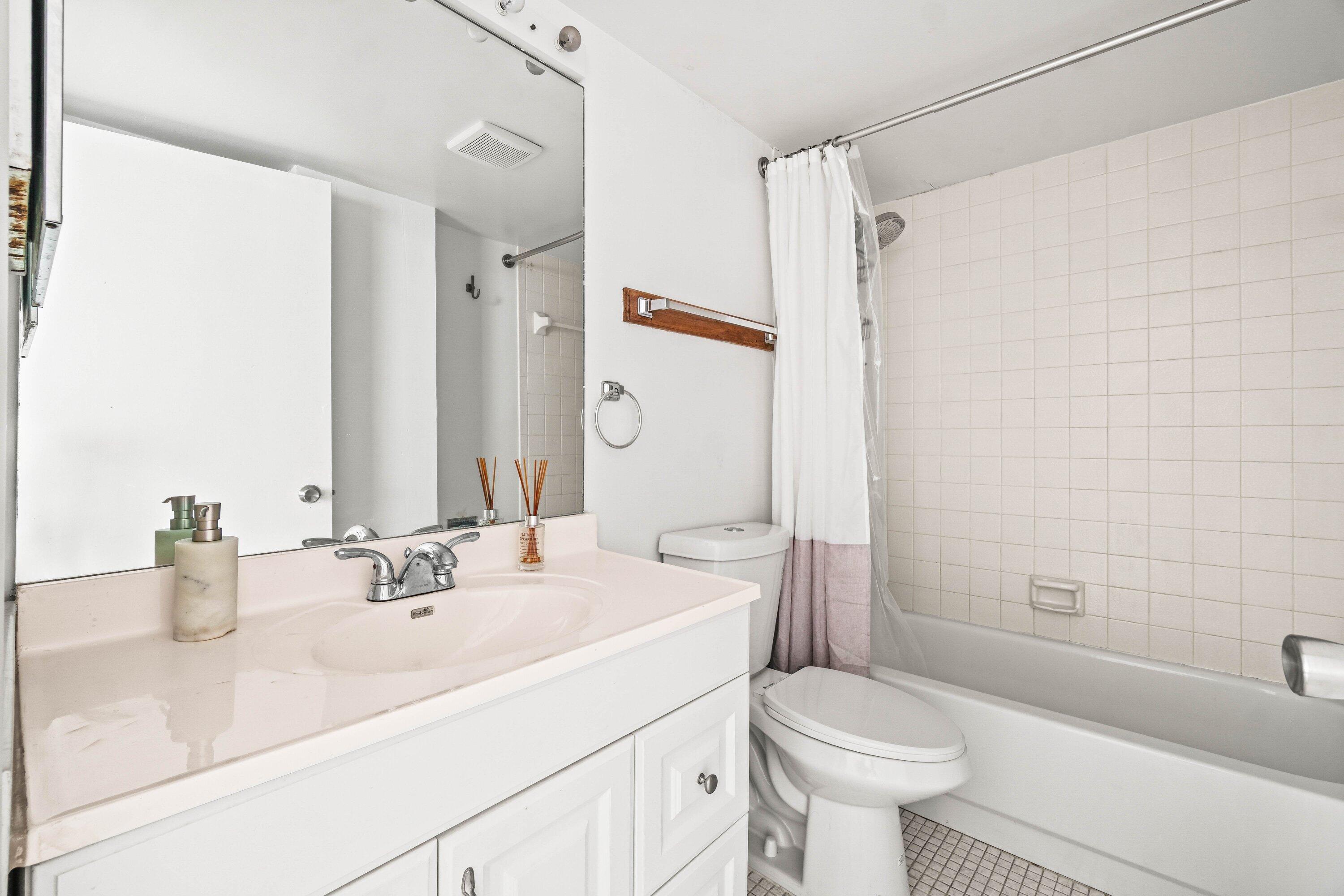 17 Royal Palm Way, Unit 103 Boca Raton, FL 33432 - Photo 24 of 28 a bathroom with a sink toilet and shower