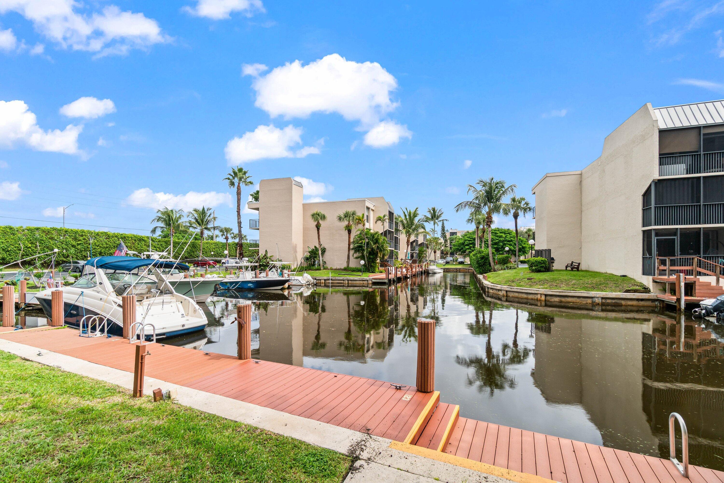 17 Royal Palm Way, Unit 103 Boca Raton, FL 33432 - Photo 4 of 28 a view of a lake with chairs
