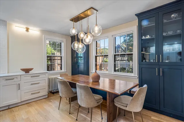 a large kitchen with lots of counter space and chandelier