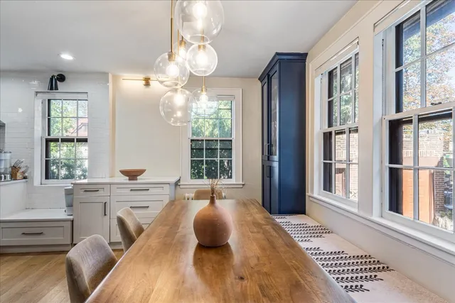 a view of a dining room with furniture window and wooden floor