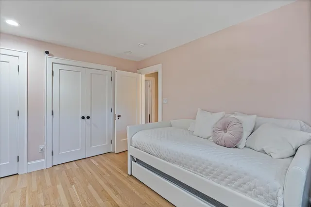 a living room with furniture a table and a large window
