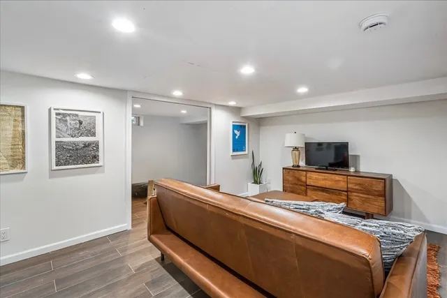 a bedroom with furniture and a potted plant