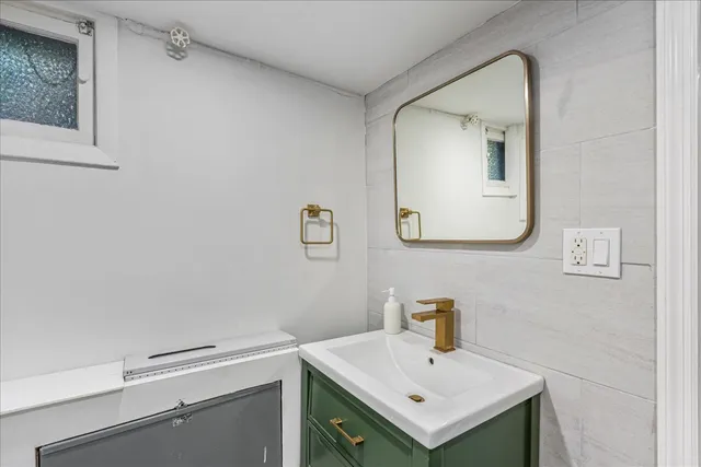 a large kitchen with a table and chairs