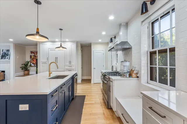 a kitchen with a stove and a sink