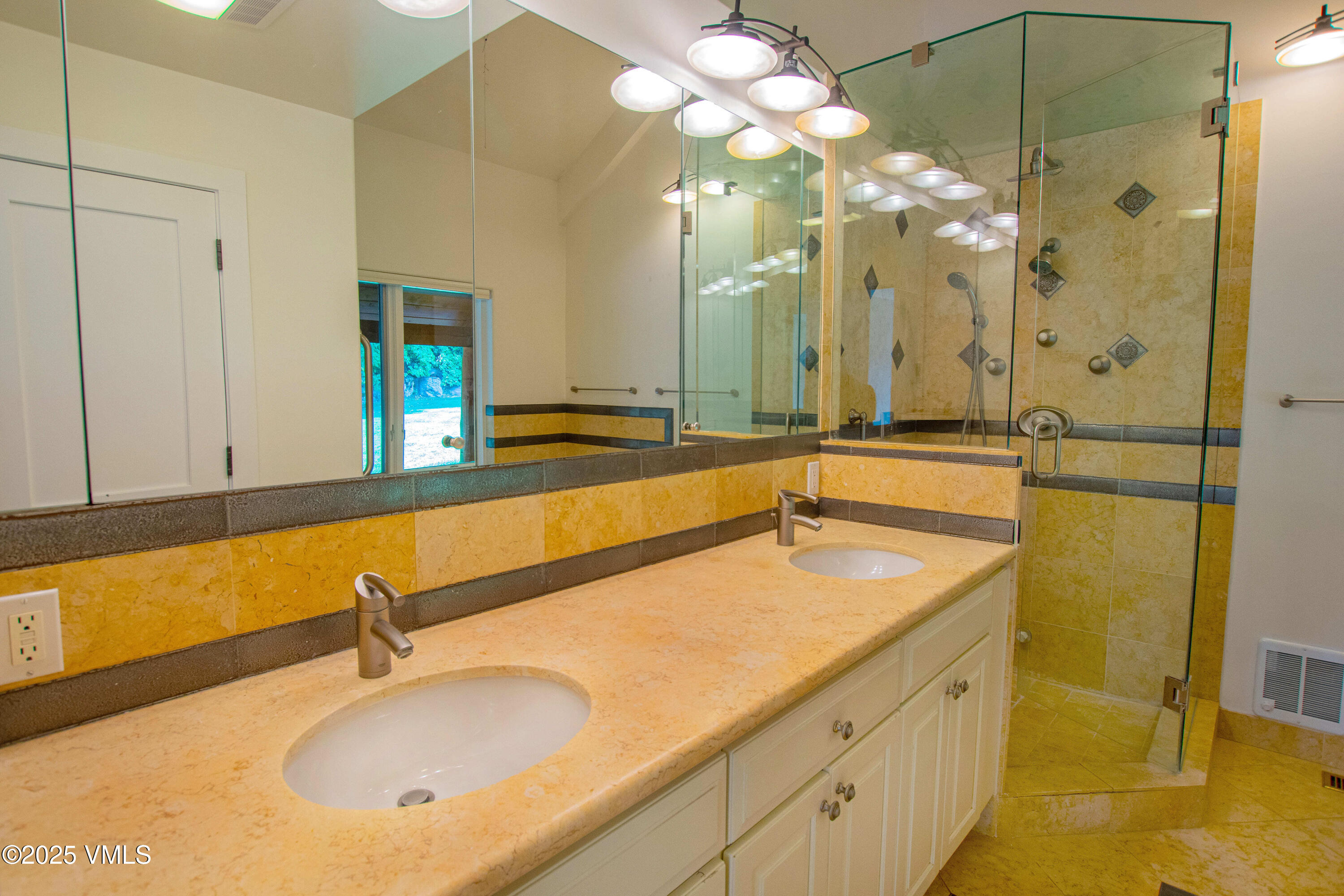 1461 Greenhill Court, Unit A AND B Vail, CO 81657 - Photo 11 of 44 a bathroom with a sink and a mirror