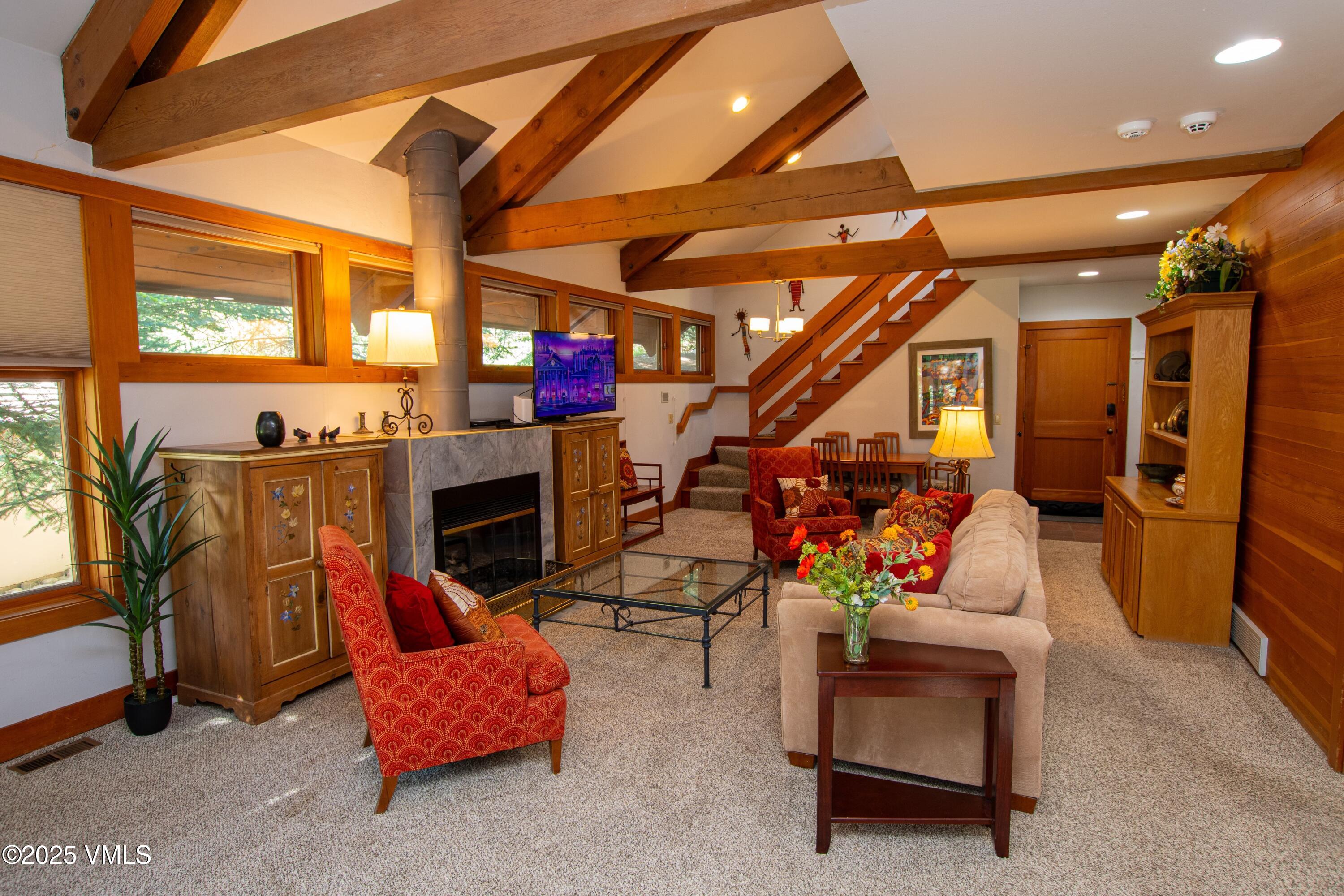 1461 Greenhill Court, Unit A AND B Vail, CO 81657 - Photo 18 of 44 a living room with furniture and a fireplace