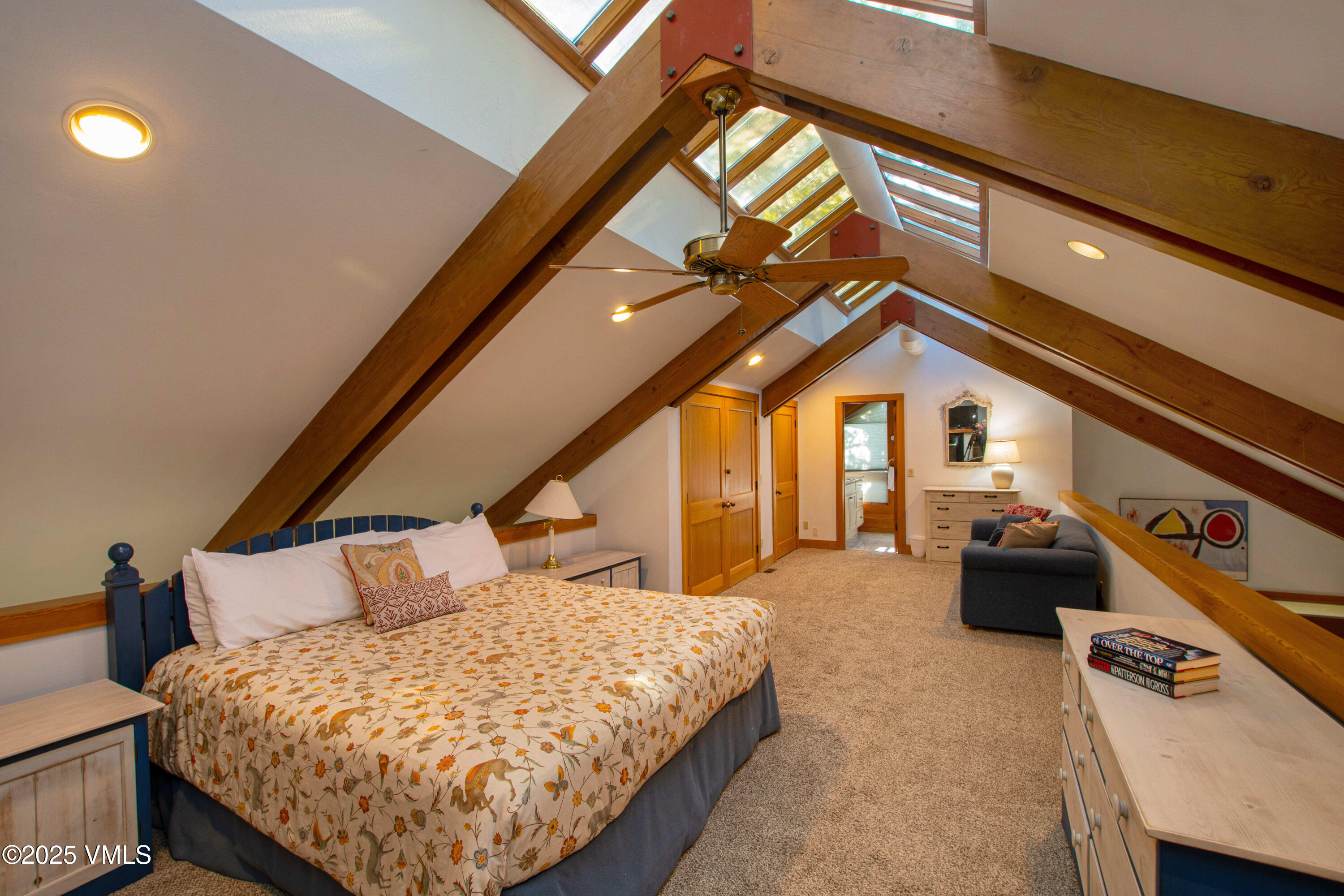 1461 Greenhill Court, Unit A AND B Vail, CO 81657 - Photo 20 of 44 a bedroom with a bed and wooden floor