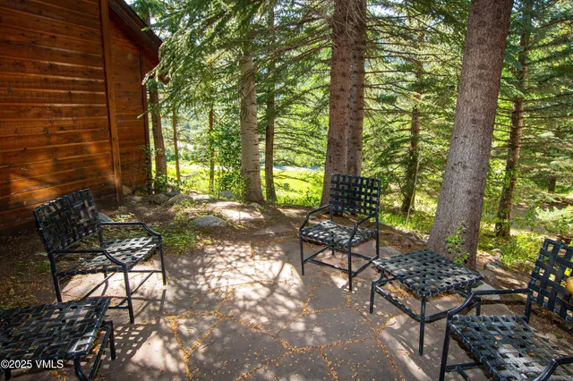 a backyard of a house with outdoor seating