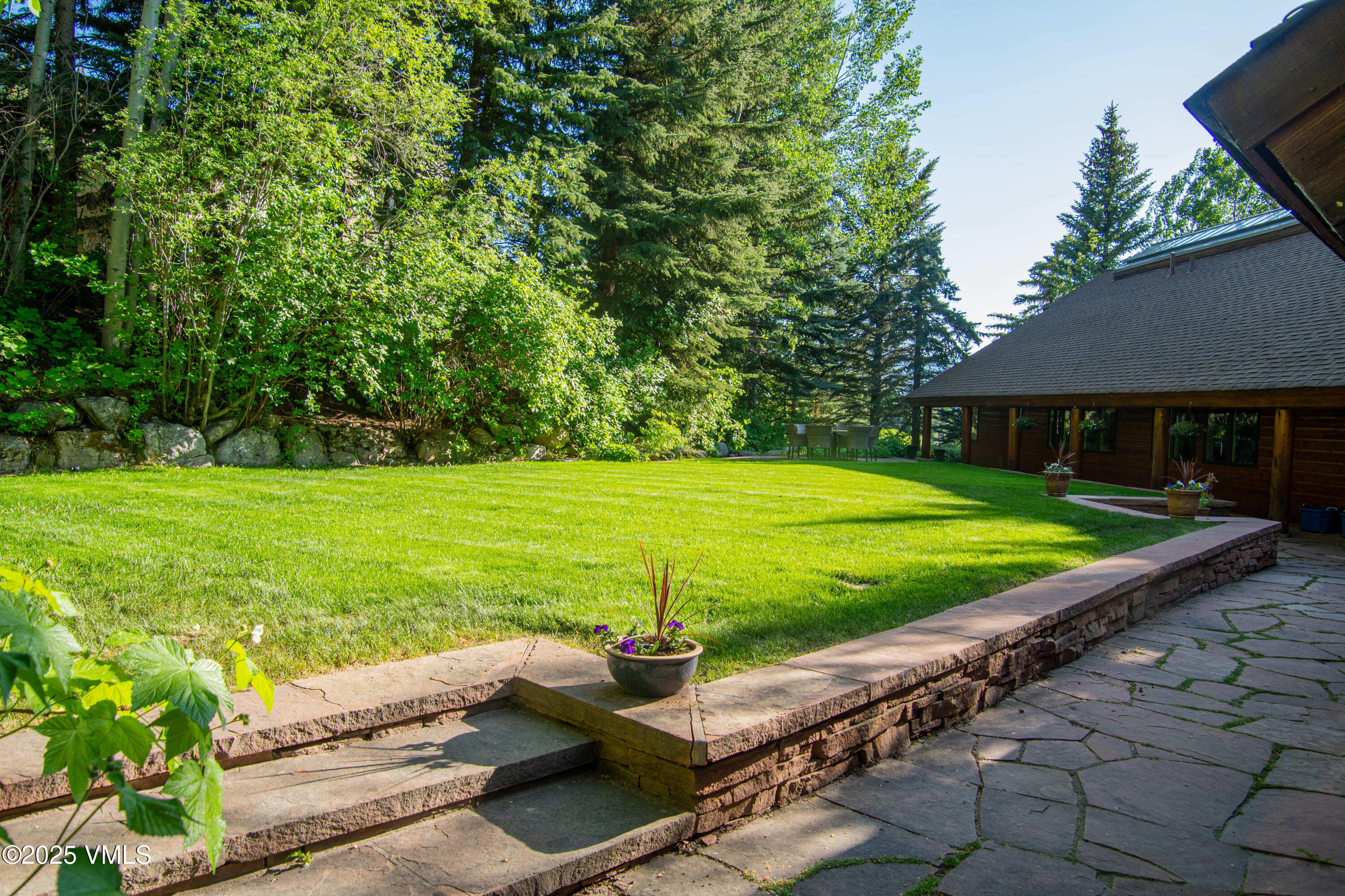 1461 Greenhill Court, Unit A AND B Vail, CO 81657 - Photo 22 of 44 a view of a house with a yard