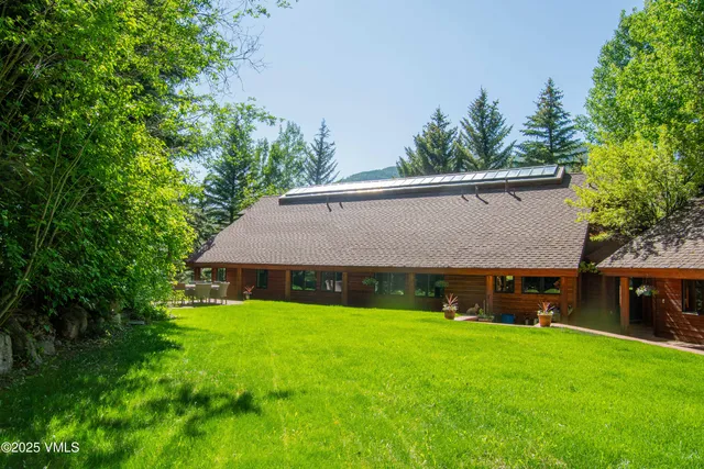 a view of house with garden and entertaining space